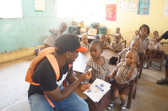 Handing Out Erasers To Nursery Student During Lagoshats.com Yearly Donation