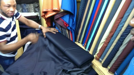 Comparing textile at Global Don B in Balogun Market